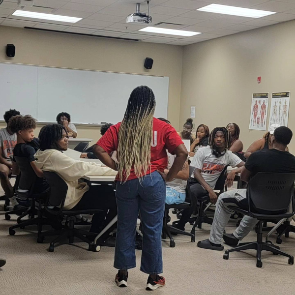 Dr. Sokonie Reed spends classroom time with GLOW students.