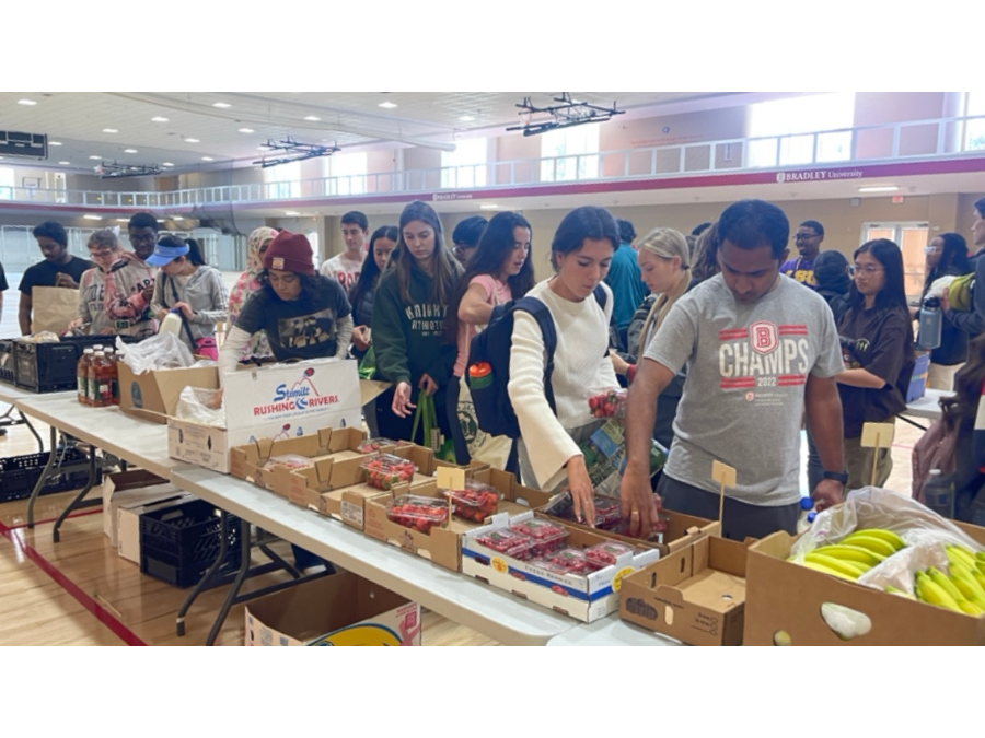 Students and community members gather in droves to purchase some of Market 309's fruits and vegetables