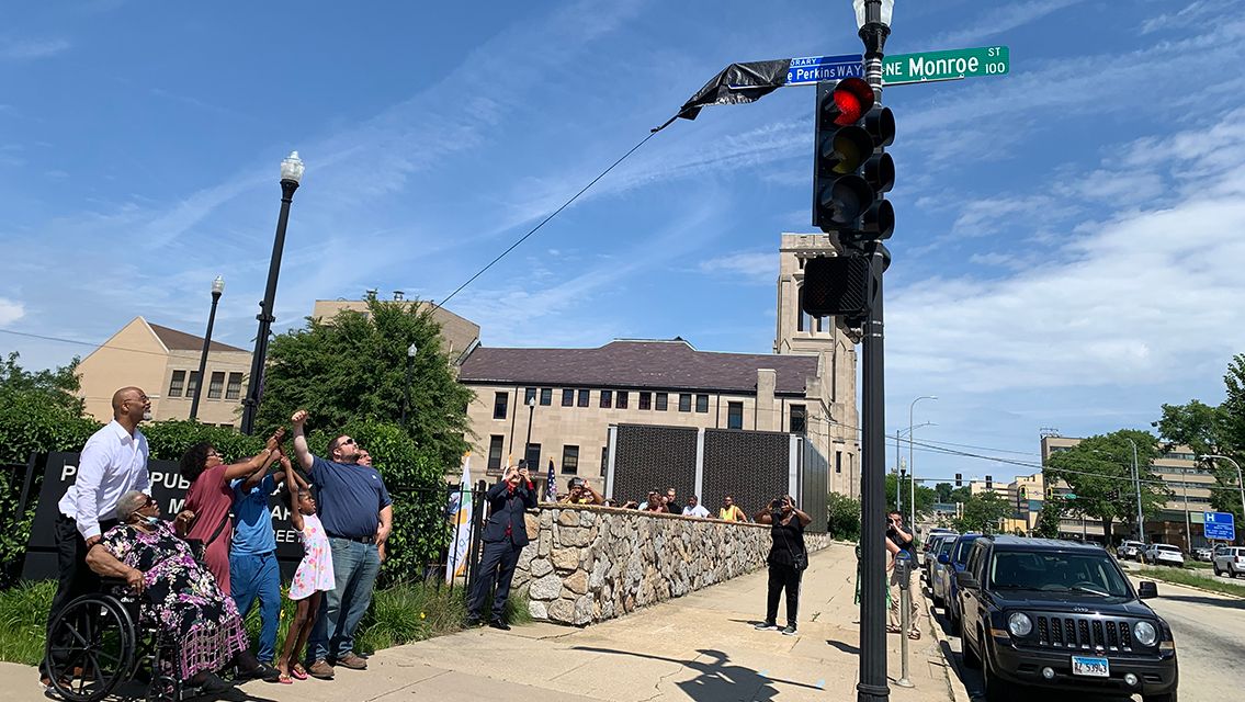 Family looking at street sign