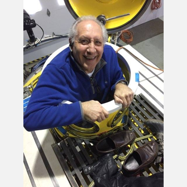 Harry Truitt '70 stepping out of an Oceangate mini submarine