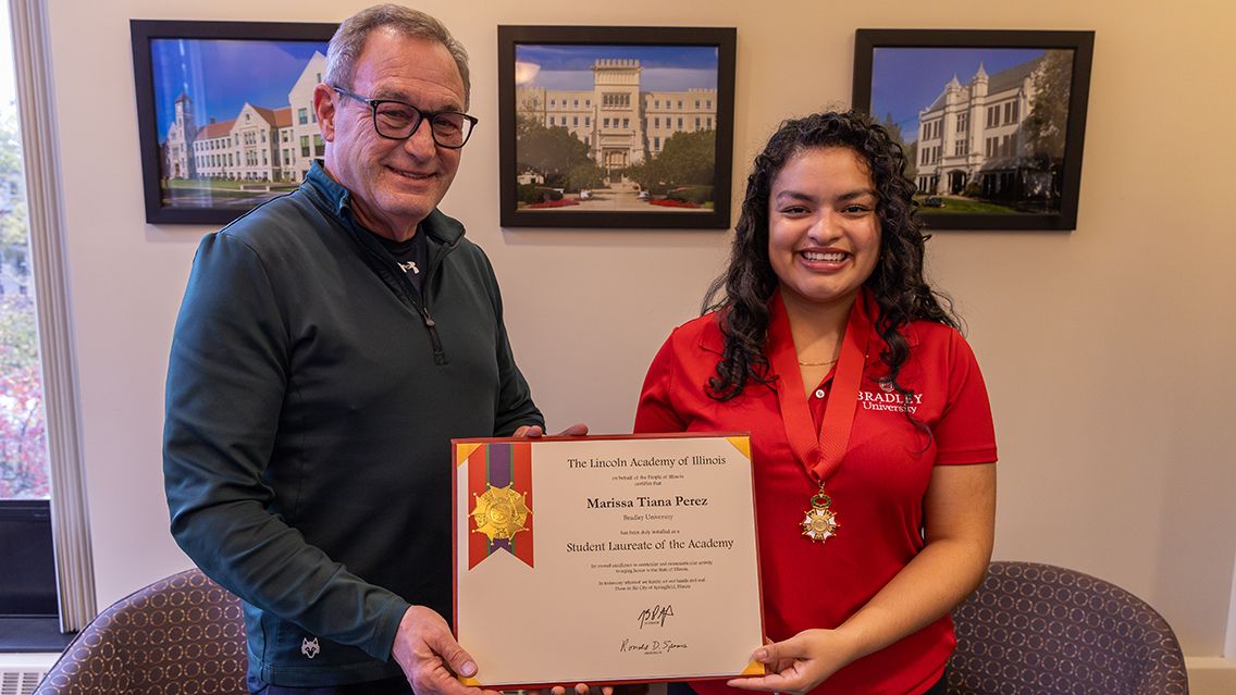 Bradley's Interim President Jon Michael congratulates BU senior Marissa Tiana Perez, who was named a Student Laureate by The Lincoln Academy of Illinois.