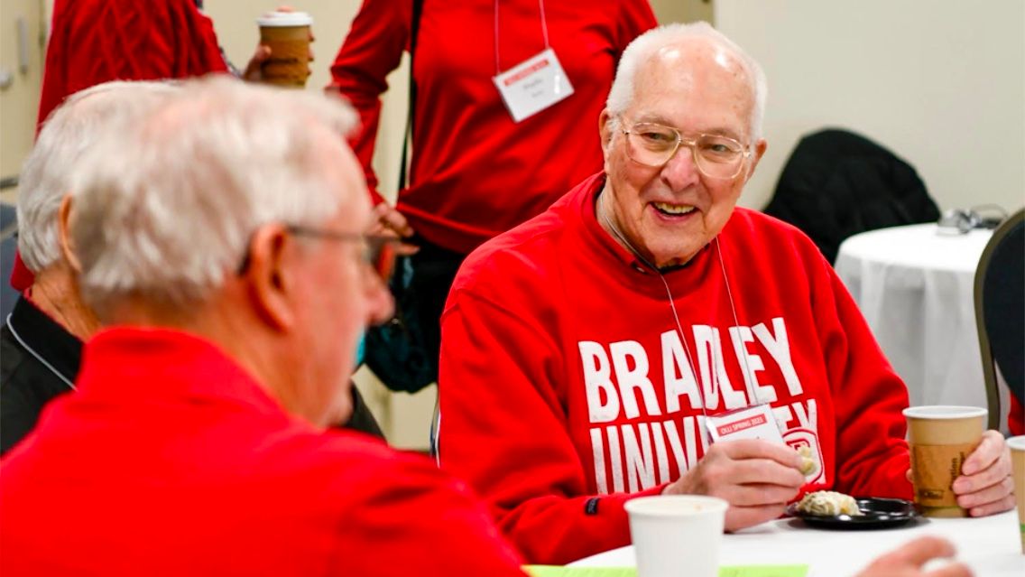 An OLLI participant socializing at one of the organization's events